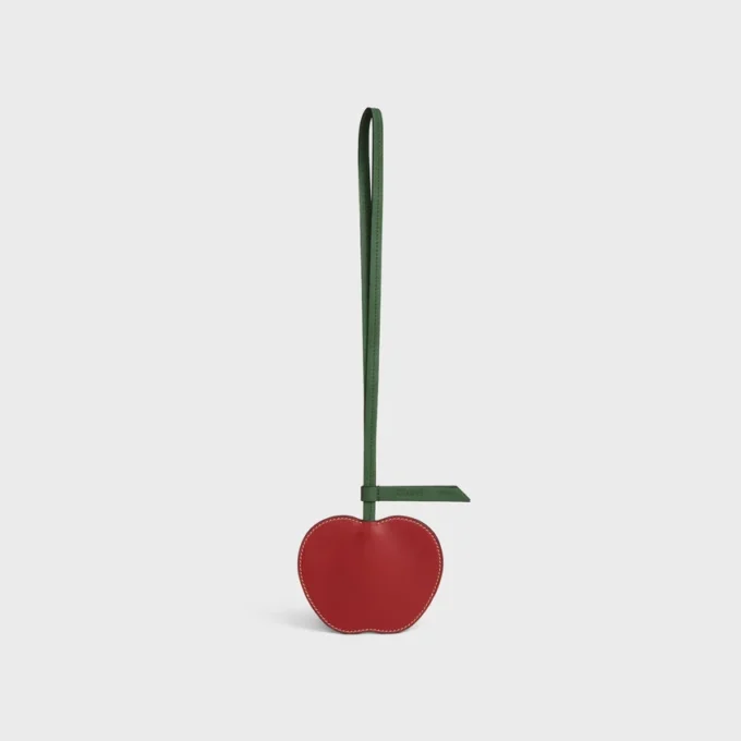 Apple-nyckelring i slätt lammskinn Apple-nyckelring i slätt lammskinn
