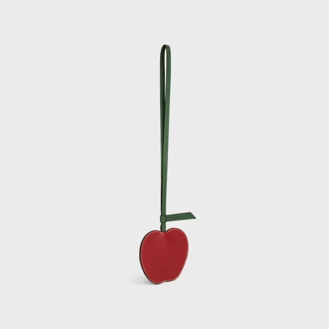 Apple-nyckelring i slätt lammskinn Apple-nyckelring i slätt lammskinn