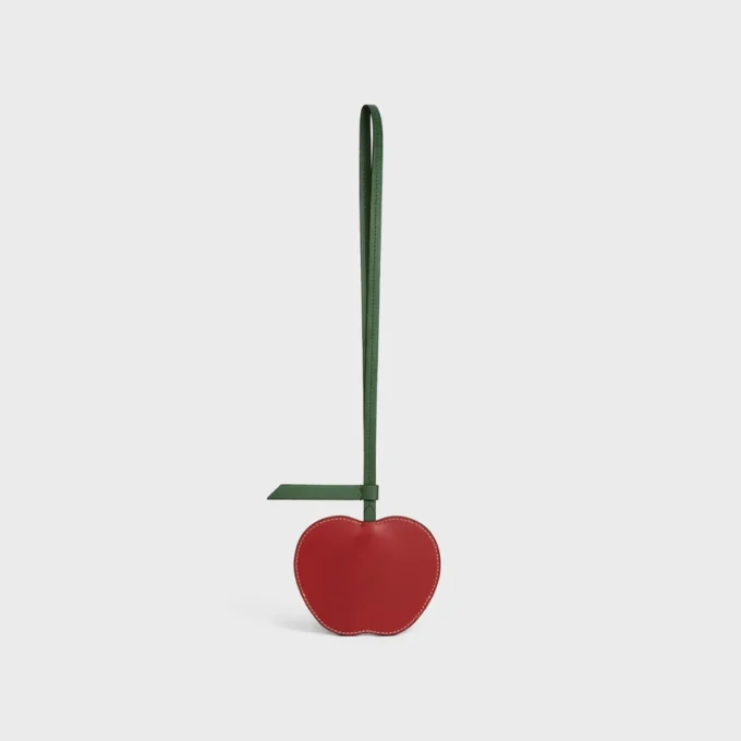 Apple-nyckelring i slätt lammskinn Apple-nyckelring i slätt lammskinn