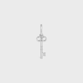 Berlock Triomphe Key i mässing med rodiumfinish
