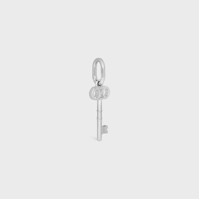 Berlock Triomphe Key i mässing med rodiumfinish Berlock Triomphe Key i mässing med rodiumfinish