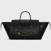 Big Smile Luggage i mjukt, glansigt lammskinn
