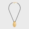 CELINE Dafila Shell-halsband i mässing med guldfinish och siden CELINE Dafila Shell-halsband i mässing med guldfinish och siden