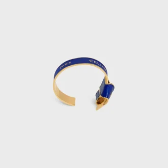 CELINE Ribbon Knotted Cuff i emalj och mässing med guldfinish