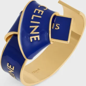 CELINE Ribbon Knotted Cuff i emalj och mässing med guldfinish