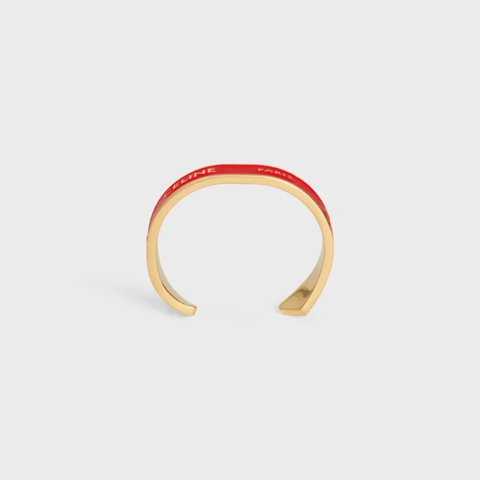 CELINE Ribbon Small Cuff i emalj och mässing med guldfinish CELINE Ribbon Small Cuff i emalj och mässing med guldfinish