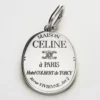 Charms CELINE-medalj i mässing med rodiumfinish