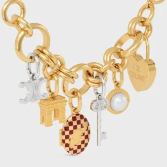 Berlock Triomphe Key i mässing med rodiumfinish