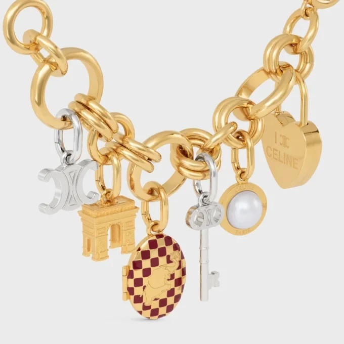 Berlock Triomphe Key i mässing med rodiumfinish Berlock Triomphe Key i mässing med rodiumfinish
