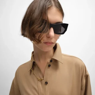 Halsband med berlocker i mässing med guldfinish