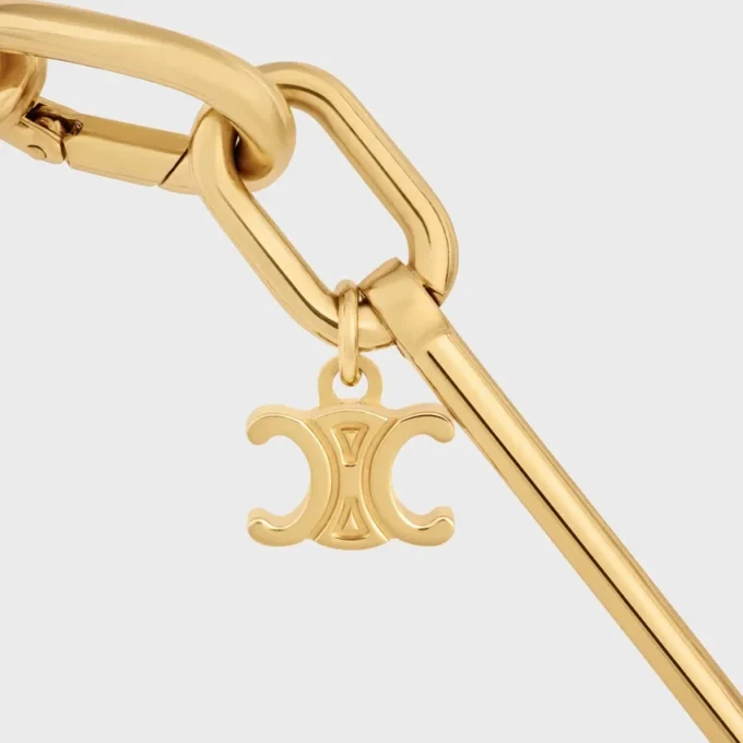 Halsband med berlocker i mässing med guldfinish Halsband med berlocker i mässing med guldfinish