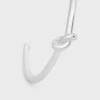 Knot Cuff i mässing med rodiumfinish Knot Cuff i mässing med rodiumfinish