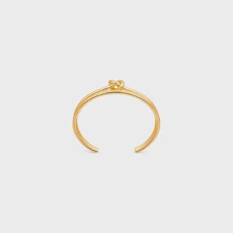 Knot Double Cuff i mässing med guldfinish
