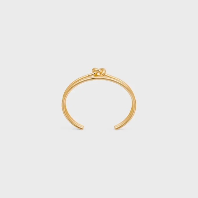 Knot Double Cuff i mässing med guldfinish