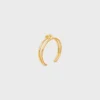 Knot Double Cuff i mässing med guldfinish