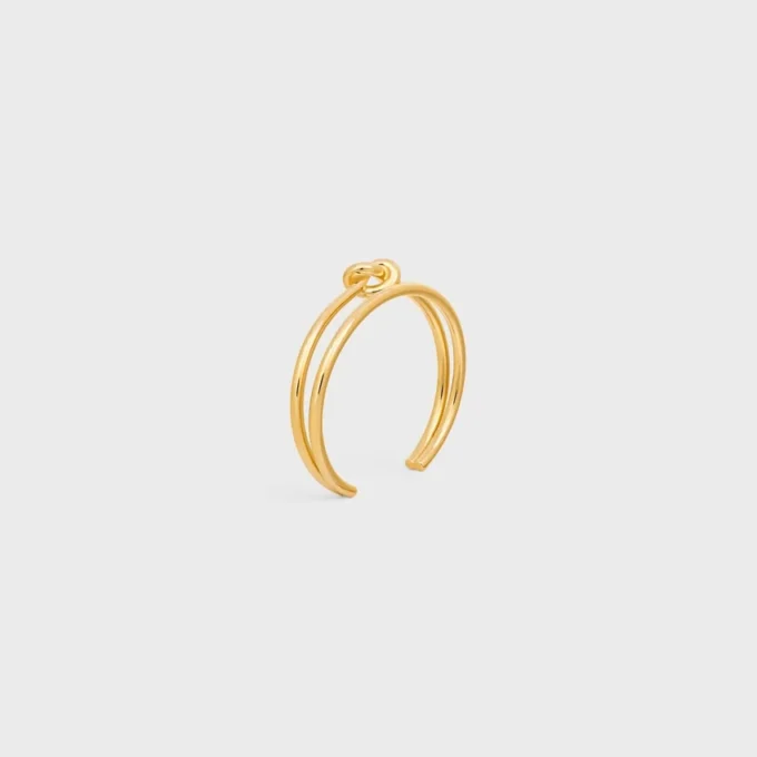 Knot Double Cuff i mässing med guldfinish