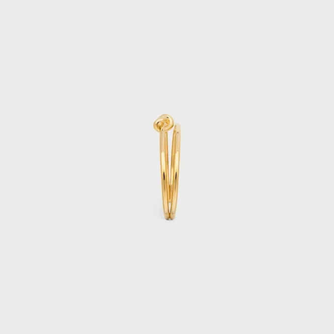 Knot Double Cuff i mässing med guldfinish