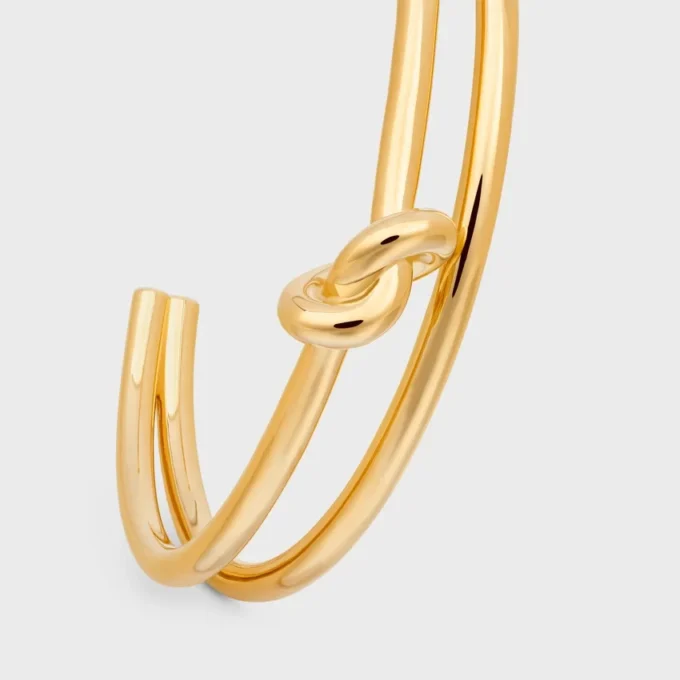 Knot Double Cuff i mässing med guldfinish