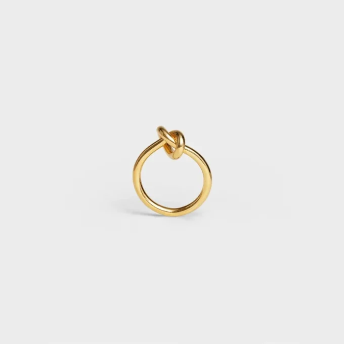 Knotring i mässing med guldfinish