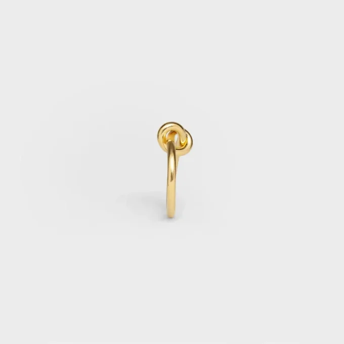 Knotring i mässing med guldfinish
