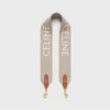 Kort rem i ull med CELINE-jacquard och gulddetaljer