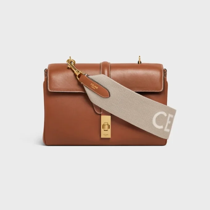 Kort rem i ull med CELINE-jacquard och gulddetaljer
