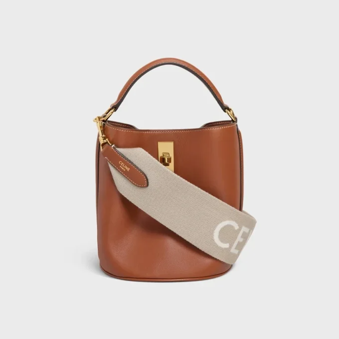 Kort rem i ull med CELINE-jacquard och gulddetaljer