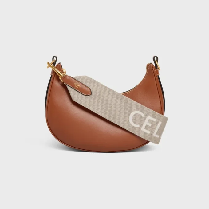 Kort rem i ull med CELINE-jacquard och gulddetaljer