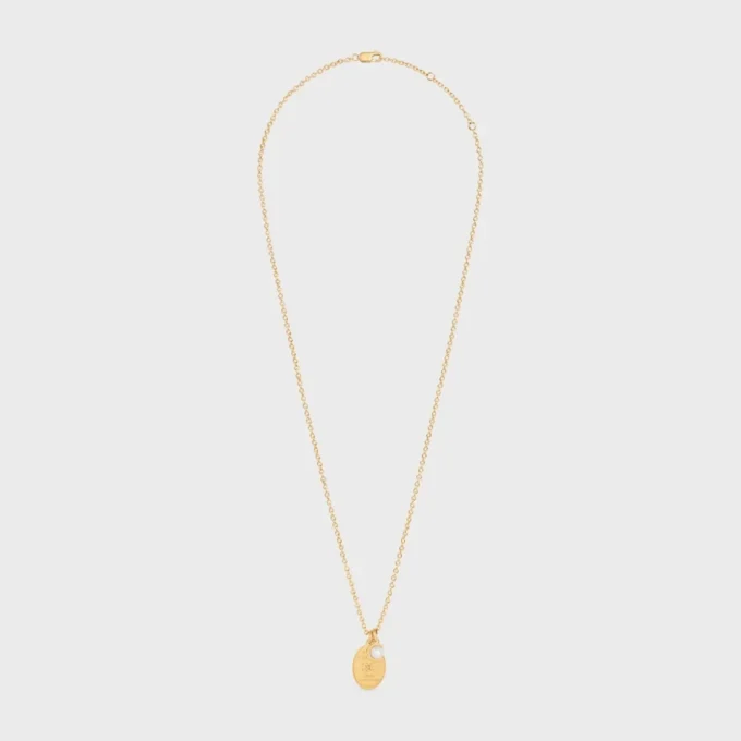 Les Perles CELINE medaljonghalsband i harts och mässing med guldfinish Les Perles CELINE medaljonghalsband i harts och mässing med guldfinish