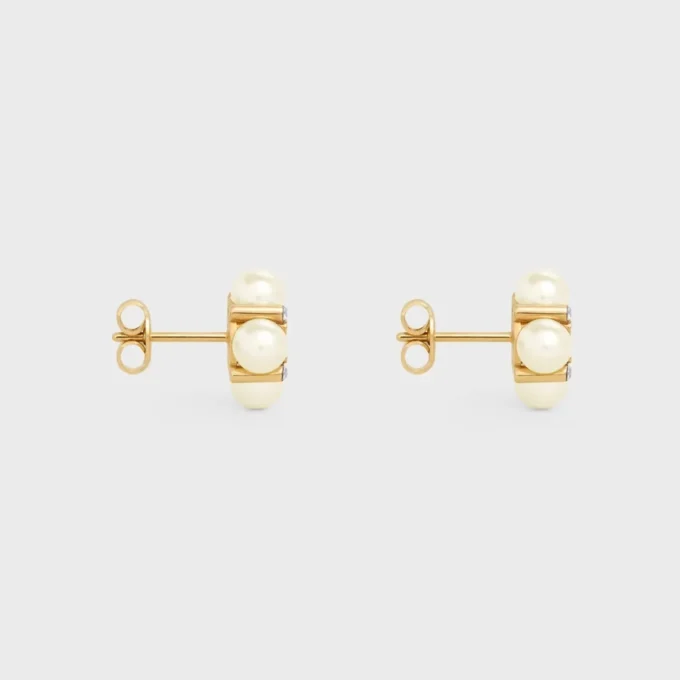 Les Perles CELINE-örhängen i strass, pärlor av harts och mässing med guldfinish Les Perles CELINE-örhängen i strass, pärlor av harts och mässing med guldfinish
