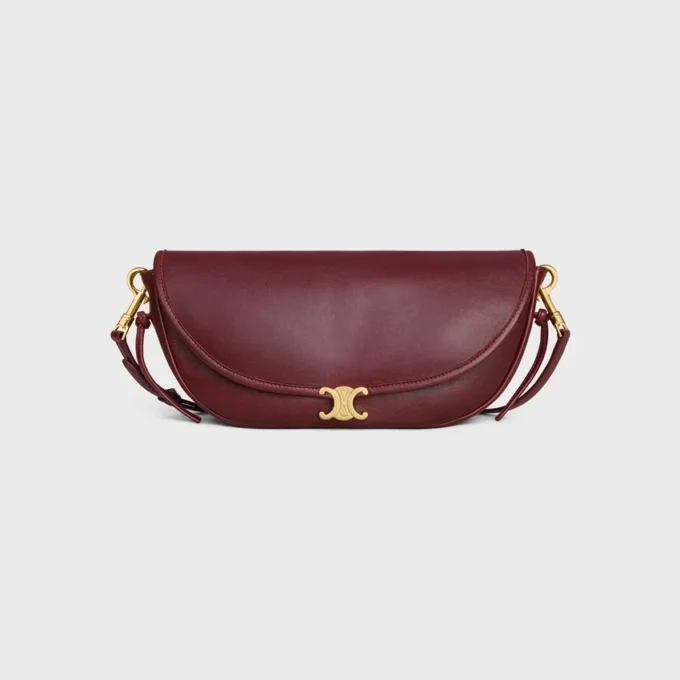 Liten Halfmoon Soft Triomphe i smidigt, glansigt lammskinn Liten Halfmoon Soft Triomphe i smidigt, glansigt lammskinn
