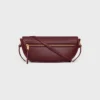 Liten Halfmoon Soft Triomphe i smidigt, glansigt lammskinn Liten Halfmoon Soft Triomphe i smidigt, glansigt lammskinn