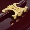 Liten plånbok med lock Triomphe i lackat kalvskinn Liten plånbok med lock Triomphe i lackat kalvskinn