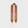 Lång rem i ull med CELINE-jacquard och gulddetaljer