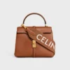 Lång rem i ull med CELINE-jacquard och gulddetaljer