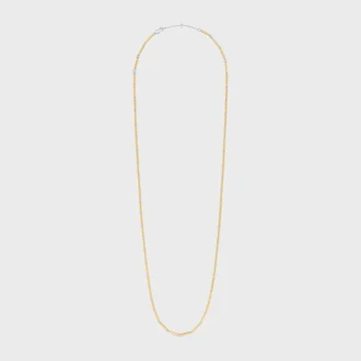 Långt halsband med berlocker i mässing med guld- och rodiumfinish Långt halsband med berlocker i mässing med guld- och rodiumfinish