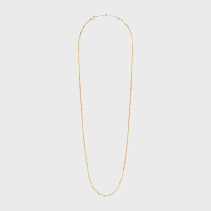 Långt halsband med berlocker i mässing med guld- och rodiumfinish Långt halsband med berlocker i mässing med guld- och rodiumfinish