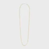 Långt halsband med berlocker i mässing med guld- och rodiumfinish Långt halsband med berlocker i mässing med guld- och rodiumfinish