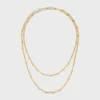 Långt halsband med berlocker i mässing med guld- och rodiumfinish Långt halsband med berlocker i mässing med guld- och rodiumfinish