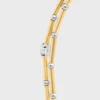 Långt halsband med berlocker i mässing med guld- och rodiumfinish Långt halsband med berlocker i mässing med guld- och rodiumfinish