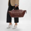 Luggage i mjukt, glansigt lammskinn