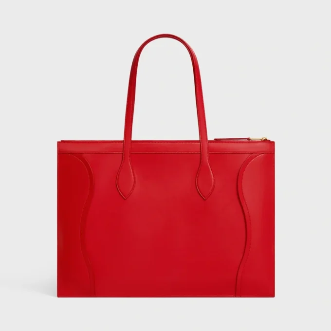 Platt luggage i glansigt kalvskinn