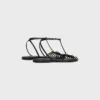 Platta sandaler med burdesign i getskinn