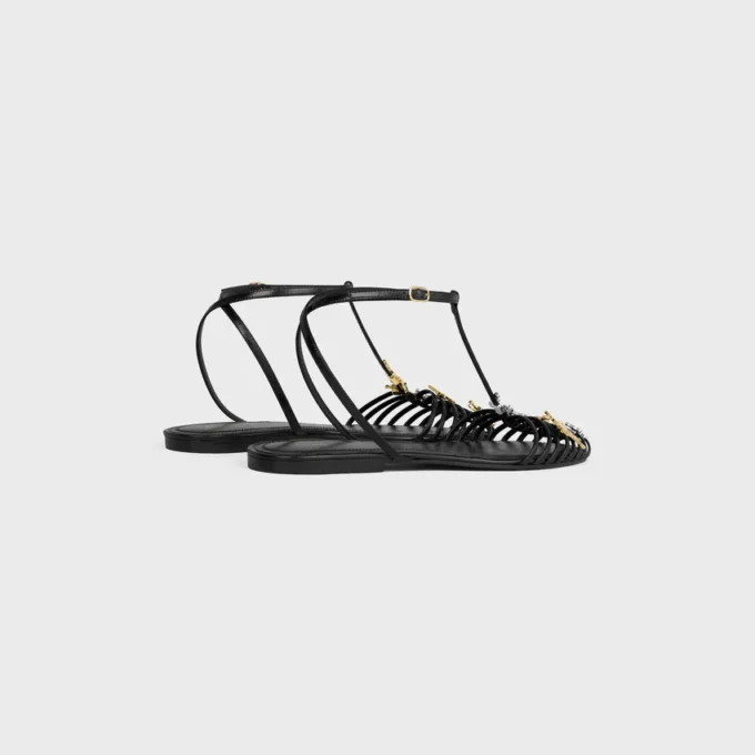 Platta sandaler med burdesign i getskinn
