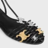 Platta sandaler med burdesign i getskinn