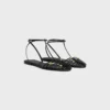 Platta sandaler med burdesign i getskinn