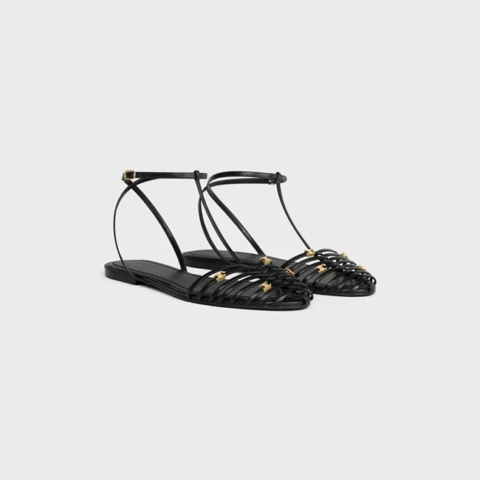 Platta sandaler med burdesign i getskinn