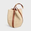 Stor Drop Bucket-väska i raffia och kalvskinn Stor Drop Bucket-väska i raffia och kalvskinn