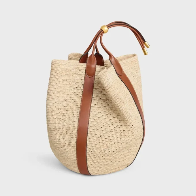 Stor Drop Bucket-väska i raffia och kalvskinn Stor Drop Bucket-väska i raffia och kalvskinn