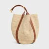 Stor Drop Bucket-väska i raffia och kalvskinn Stor Drop Bucket-väska i raffia och kalvskinn